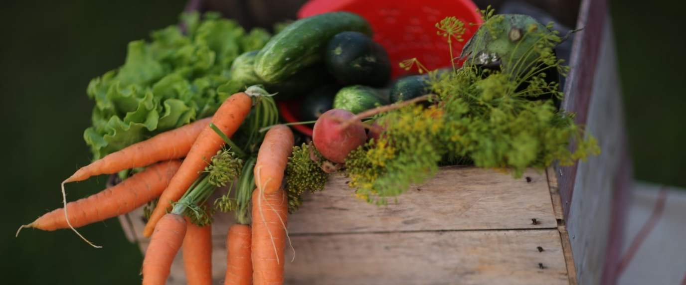 wooden crate full of vegetables