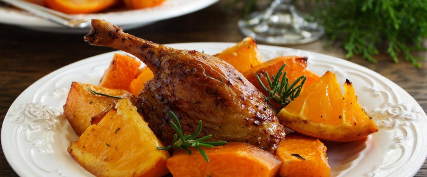 quail displayed on a plate with sauce and root vegetables